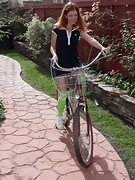 Cindy rides her bike and then strips naked outdoors - picture #2