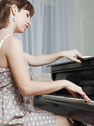 Sasha K strips naked and spreads her body over piano - picture #5