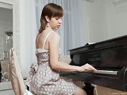 Sasha K strips naked and spreads her body over piano - picture #6