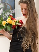 Ryisya strips naked and drapes flowers across body - picture #5