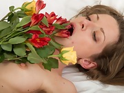 Ryisya strips naked and drapes flowers across body - picture #27