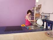 Miki cleans up in the kitchen - picture #18