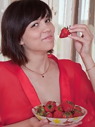 Sasha M nibbles her strawberry - picture #2