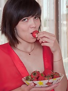 Sasha M nibbles her strawberry - picture #5