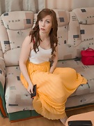 Kira Fox tears off yellow skirt to get naked - picture #1