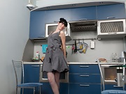 Stripping in the kitchen with sheer grey stockings - picture #4