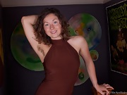 Wearing a sexy brown dress before playing - picture #3