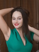 Rene takes off a green dress to model nude in bed  - picture #7