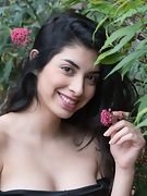 Ornella strips outdoors with a sexy rose in hand - picture #3