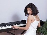 Kassiana plays the piano and then masturbates  - picture #2