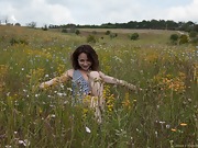 Shaya masturbates on her towel in the fields - picture #6