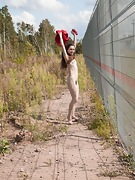 Lisa Li strips off her red dress outdoors - picture #5
