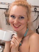 Foxy strips naked as she enjoys her tea - picture #5