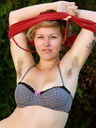 Lilah rubs her hairy pussy outdoors - picture #3