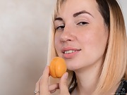 Sasha K strips naked while having an apricot - picture #3