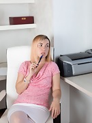 Sasha K strips naked at her work desk - picture #4