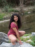 Maria F strips naked outside on the rocks - picture #12