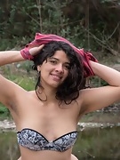 Maria F strips naked outside on the rocks - picture #18