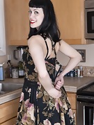 Little Olive masturbates in her brown kitchen - picture #2