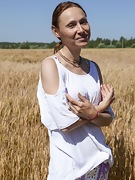 Nata strips naked outside in her wheat field - picture #2