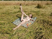 Nata strips naked outside in her wheat field - picture #36