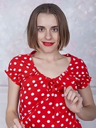 Anolia strips off her red dotted dress in bed - picture #22