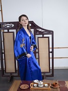 Christy poses in her blue kimono enjoying tea - picture #4