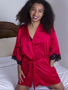 Divine models her silk robe in bed - picture #1