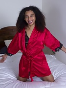 Divine models her silk robe in bed - picture #8