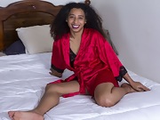 Divine models her silk robe in bed - picture #10