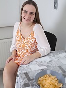 Beatrice A strips nude at her dining table - picture #2