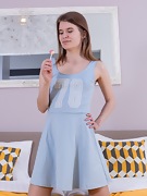 Emaza has fun with her blue dress in bed - picture #1