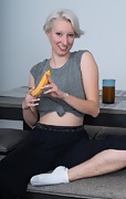 Pains enjoys a banana at her work desk naked - picture #6