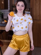 Krista Williams enjoys an orange and nakedness - picture #1
