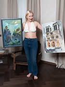 VeroniKa hangs her pictures and masturbates - picture #1