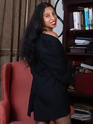 Divine poses in her sexy black blazer by a chair - picture #8