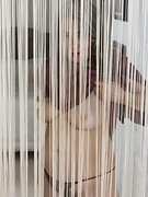 Jamie appears naked from behind her rope curtains - picture #17