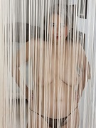 Jamie appears naked from behind her rope curtains - picture #19