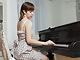 Sasha K strips naked and spreads her body over piano